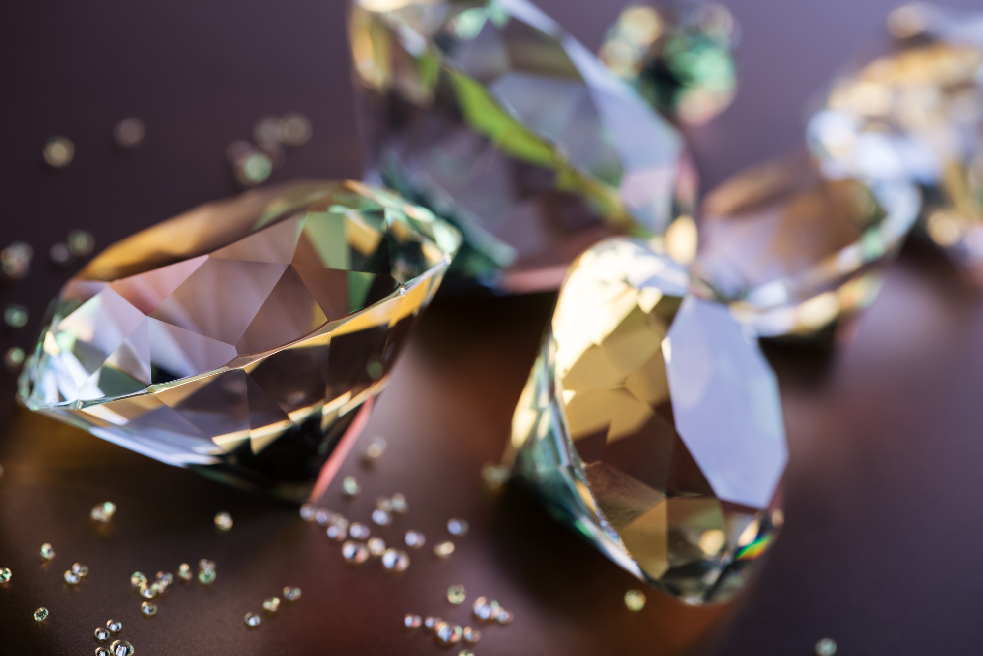 selective focus of big and small diamonds on brown background