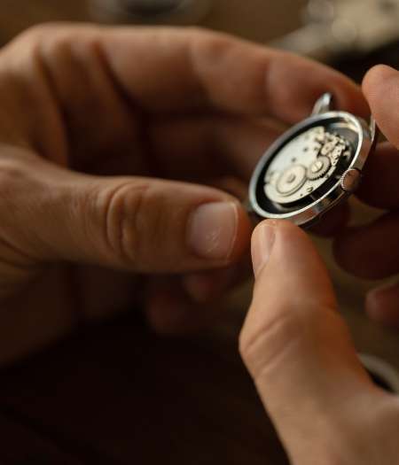 The watchmaker repairs the mechanical watch
